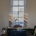 Unlit Tangerine Onyx lamp pair with fine peach and gray upper layers above sweeping dark bands in the lower stone.