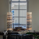 Unlit Tangerine Onyx lamp pair showing ivory and apricot crystal layers, gray and brown marbling, and fine dark rings at the bases.