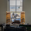 Unlit Aqua Onyx lamp pair showing arched lower banding, cream and honey stone, cord exits, and inline on/off switches.