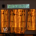 Illuminated natural onyx feature wall handcrafted by Vilona family artisans