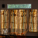 Four backlit onyx panels measuring 63 inches high by 23.75 inches wide