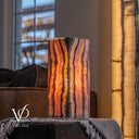 Sculptural Rosa Onyx accent lamp glowing with dark mineral lines and naturally layered stone movement