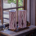 Unlit Rosa Onyx table lamp pair showing natural blush, mauve, cream, and burgundy stone patterns