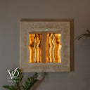 Unlit White Ice Onyx square mirror showing natural ivory coloring and a sculpted inner live edge