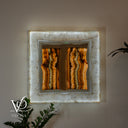 Luxury White Ice Onyx wall mirror illuminated in a warm golden setting with an organic inner stone edge
