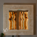 Handcrafted natural stone mirror with a polished square White Ice Onyx frame and organic opening