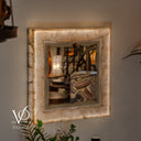 Handcrafted White Ice Onyx wall mirror glowing through cream, ivory, and champagne natural stone banding