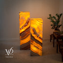 Handcrafted Miami Sunset Onyx tower lamps illuminated to reveal dramatic layered mineral patterns