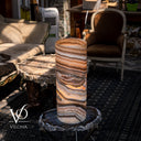Luxury Sahara Onyx cylinder lamp glowing warmly with desert-toned natural onyx patterns