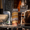 Handcrafted Miami Sunset Onyx table lamp lit from within to reveal dramatic horizontal mineral layers