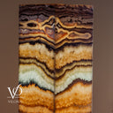Natural Aqua Onyx floor lamp glowing with exceptional translucency and bold horizontal mineral banding