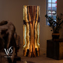 Illuminated Vertical Band Aqua Onyx floor lamp glowing with cream, honey, amber, brown, and subtle aqua mineral layers