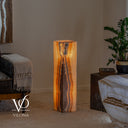 Natural Aqua Onyx floor lamp glowing warmly with layered vertical stone banding and polished square sides