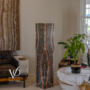 Unlit Tangerine Onyx floor lamp showing a pointed central pattern in muted peach, ivory, gray, and charcoal.