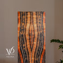 Upper detail of the illuminated Tangerine Onyx floor lamp with ivory and amber ribbons surrounded by charcoal bands.