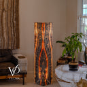 Illuminated Tangerine Onyx tower showing an elongated dark central pattern outlined by glowing orange bands.