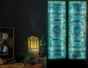 Blue and green mosaic glass window panels with intricate patterns, likely made of recycled materials.