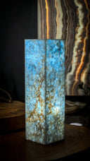 Blue and white marble table lamp with a hexagonal base.