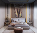 Gray upholstered platform bed with gold accents and modern design.