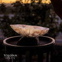 Onyx bowl with swirling marbled pattern and natural stone texture, vilona brand.