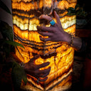 Onyx lamp with warm glow and natural stone texture.