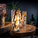 Onyx table lamp with natural marbled pattern and warm glow.