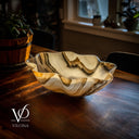 Decorative bowl on a wooden surface with a blurred background