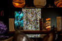 A rectangular, illuminated panel featuring a vibrant, natural agate pattern with swirling bands of purple, green, and brown.