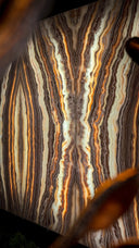 Striped agate stone coaster set with earthy tones and natural patterns.