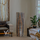 Unlit Tangerine Onyx floor lamp showing natural orange, cream, charcoal, brown, and black vertical banding