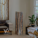 Handcrafted 51-inch Tangerine Onyx tower with a dramatic centered flame-like stone formation shown unlit