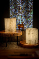 Two cylindrical table lamps with a mosaic of light-colored, textured wooden slats.